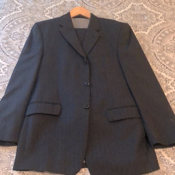 Very nice Calvin Klein suit. Jacket and Pants. Navy blue with fine pinstripes